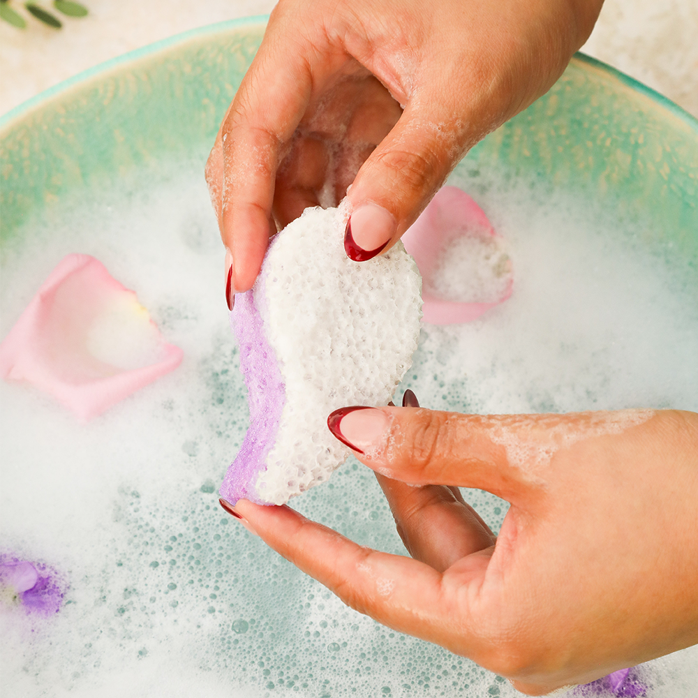 Angled front view with bag zipped and handles upright.